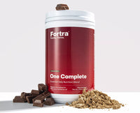 Red container of Fortra One Complete with chocolate pieces and powder on a white background